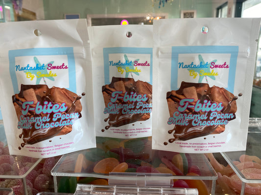 Three packages of Nantasket Sweets T-bites on a clear stand.