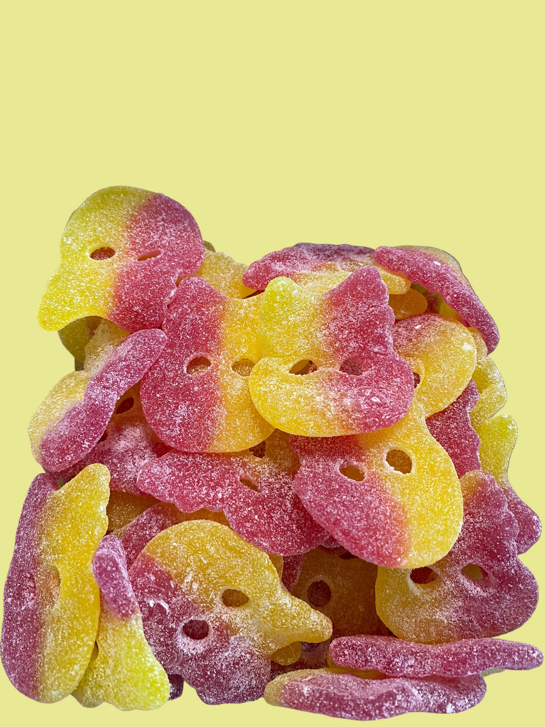 Stack of red and yellow gummy bubs in a clear container.
