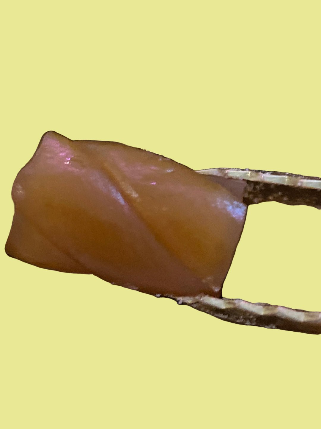 Close-up of a piece of caramel licorice twist 
