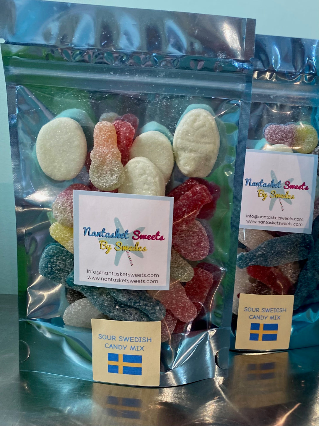 Packaged candy mix with 'Nantasket Sweets' label on a reflective surface