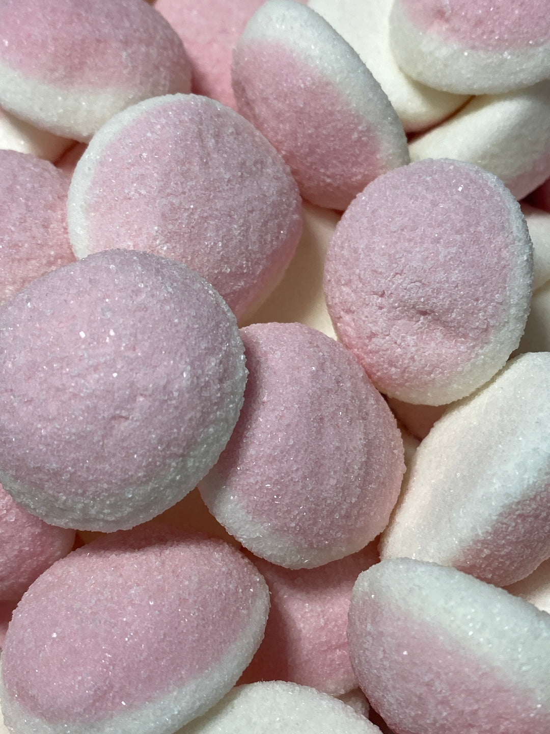 Close-up of pink and white sugared candies