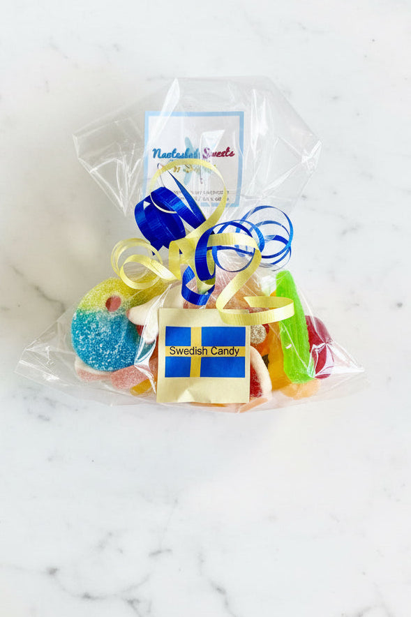Packaged Swedish candy with ribbons and a visible brand tag in a store setting.