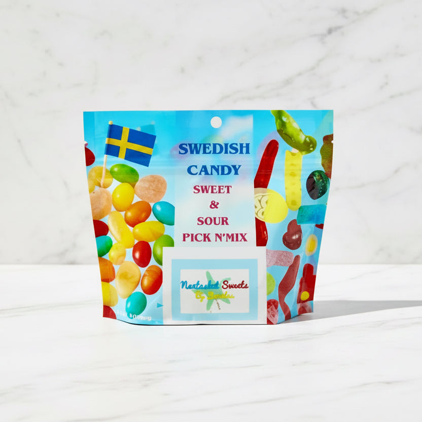Bag of Swedish candy with colorful jelly beans on a wooden surface outdoors.
